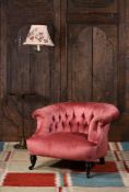 A VICTORIAN UPHOLSTERED LOW 'HORSESHOE' ARMCHAIR