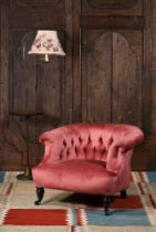 A VICTORIAN UPHOLSTERED LOW 'HORSESHOE' ARMCHAIR