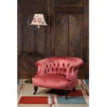 A VICTORIAN UPHOLSTERED LOW 'HORSESHOE' ARMCHAIR