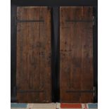 A PAIR OF SPANISH OAK AND IRON MOUNTED DOORS