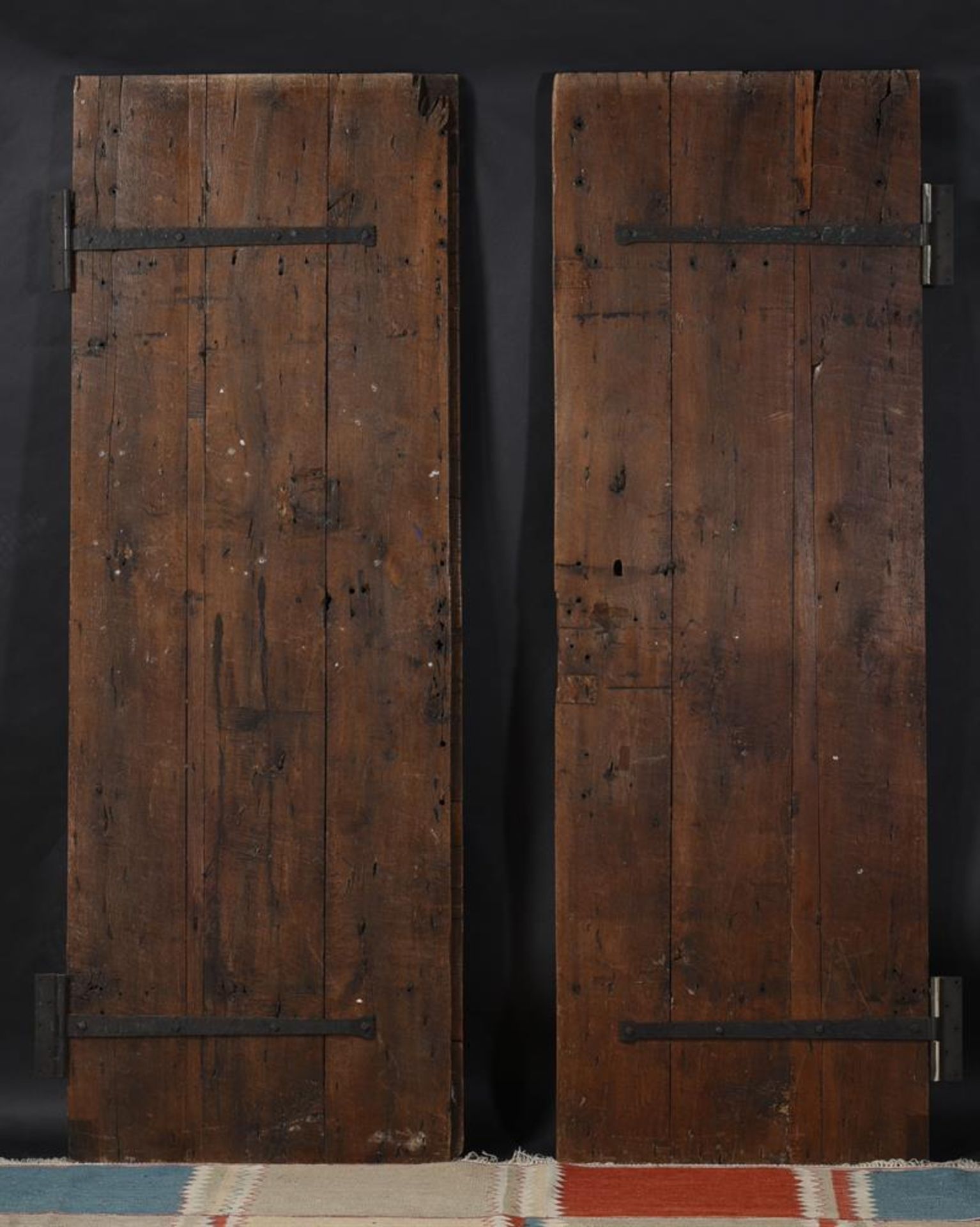 A PAIR OF SPANISH OAK AND IRON MOUNTED DOORS