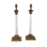 A PAIR OF MOULDED GLASS COLUMNAR LAMPS, IN CORINTHIAN TASTE