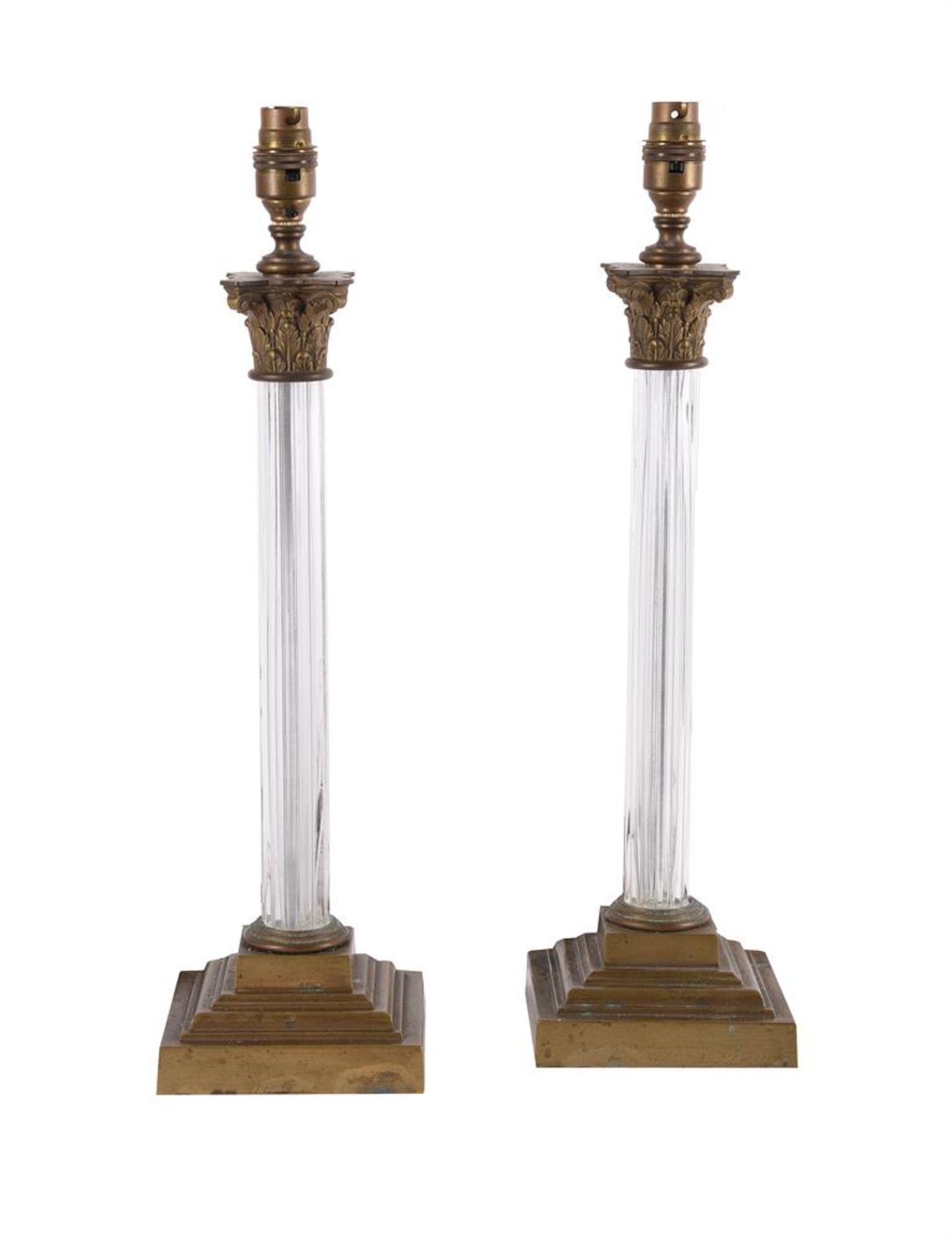 A PAIR OF MOULDED GLASS COLUMNAR LAMPS, IN CORINTHIAN TASTE