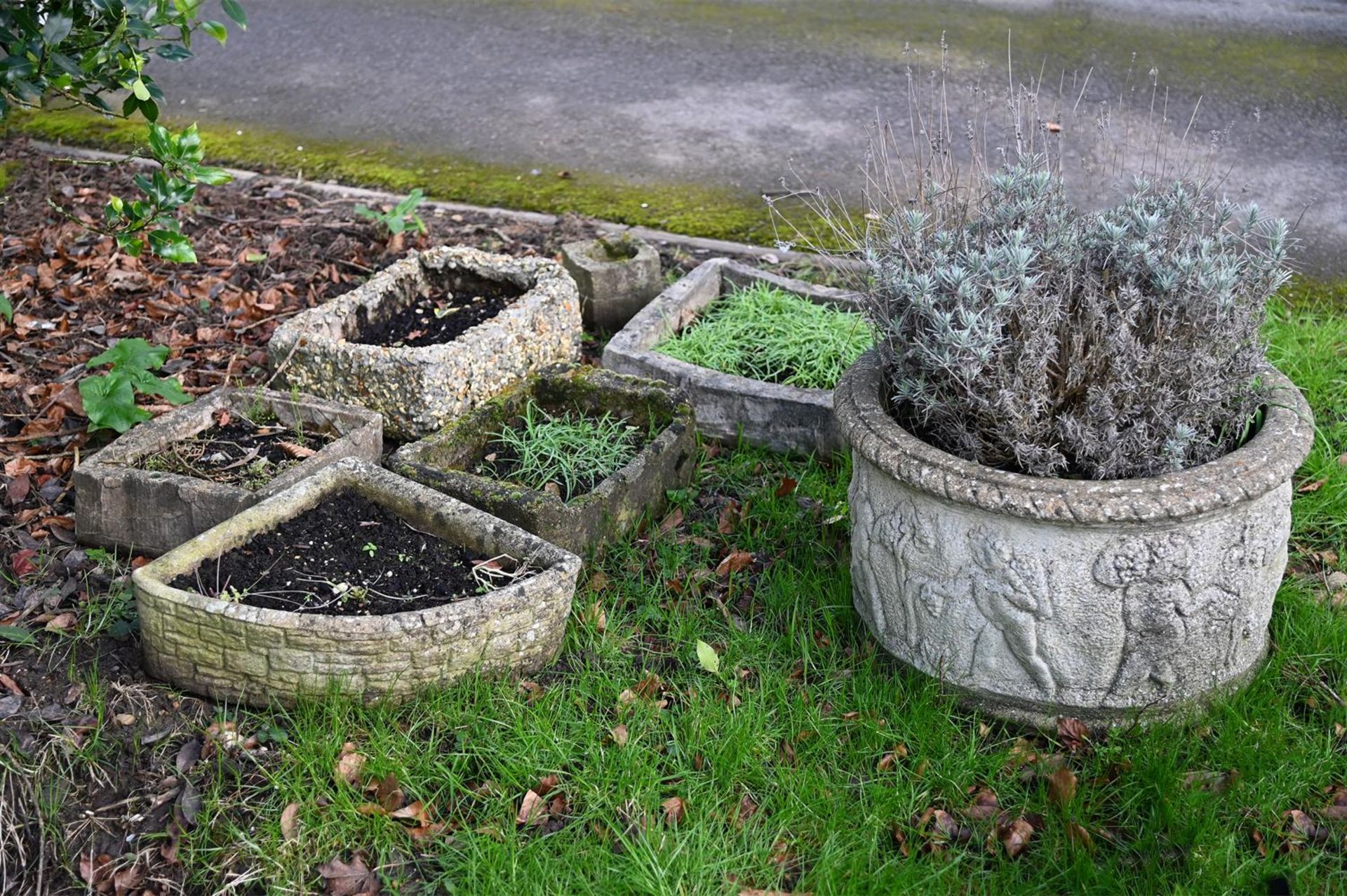 A GROUP OF VARIOUS STONE COMPOSITION GARDEN PLANTERS