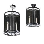 A SET OF TWELVE MIRRORED WALL LIGHTS WITH CANDLE BULBS, TOGETHER WITH TWO PENDANT LANTERNS EN-SUITE