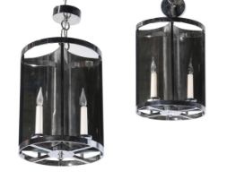 A SET OF TWELVE MIRRORED WALL LIGHTS WITH CANDLE BULBS, TOGETHER WITH TWO PENDANT LANTERNS EN-SUITE