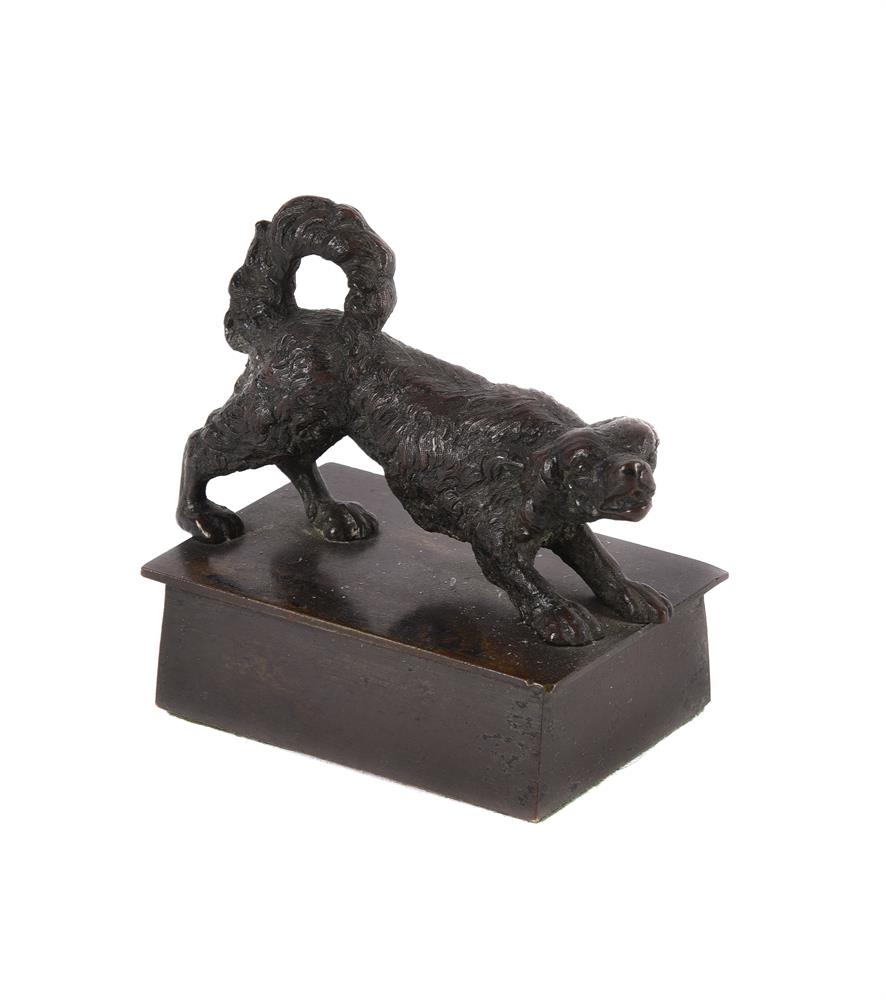 A BRONZE MODEL OF A SPANIEL