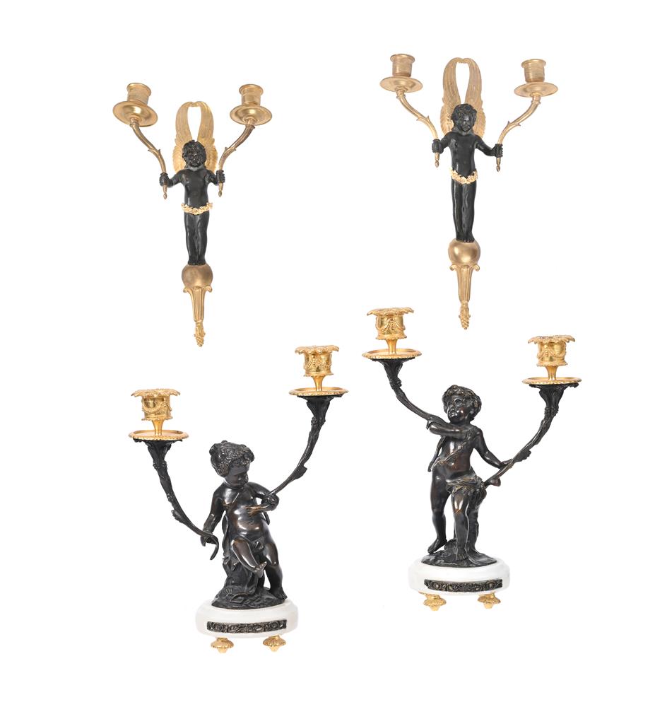 A PAIR OF BRONZE AND GILT METAL, TWIN-BRANCH FIGURAL CANDELABRA