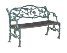 A GREEN PAINTED CAST IRON GARDEN BENCH AFTER THE 'RUSTIC SETTEE' PATTERN, 20TH CENTURY