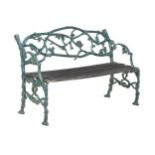 A GREEN PAINTED CAST IRON GARDEN BENCH AFTER THE 'RUSTIC SETTEE' PATTERN, 20TH CENTURY