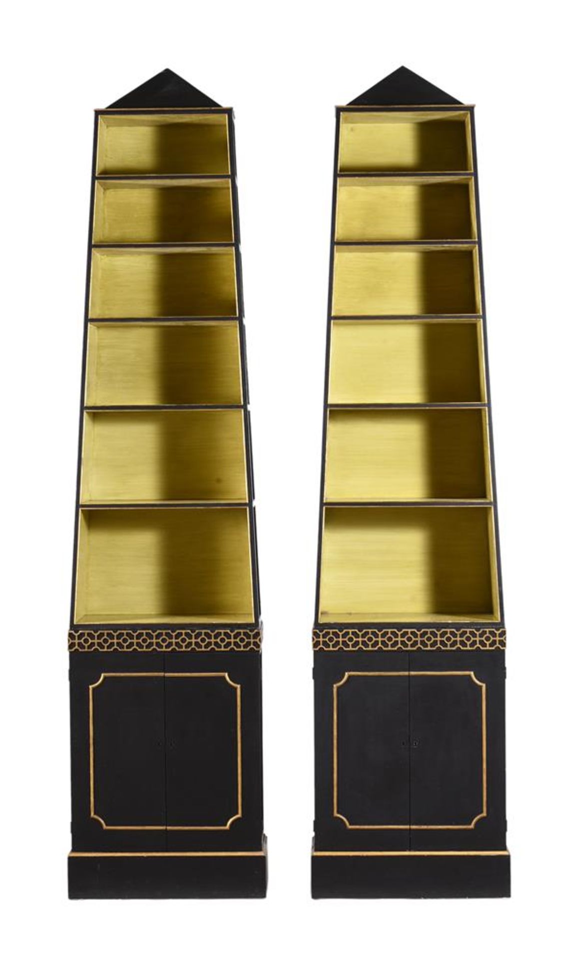 A PAIR OF EBONISED AND PARCEL GILT 'PYRAMID' OPEN BOOKCASES