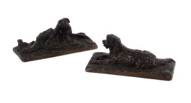 AFTER FRATIN, A PAIR OF BRONZE MODELS OF RECUMBENT SPANIELS