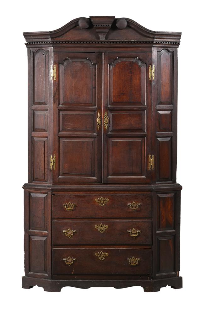 A GEORGE II CARVED OAK CORNER CUPBOARD, MID 18TH CENTURY