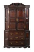 A GEORGE II CARVED OAK CORNER CUPBOARD, MID 18TH CENTURY