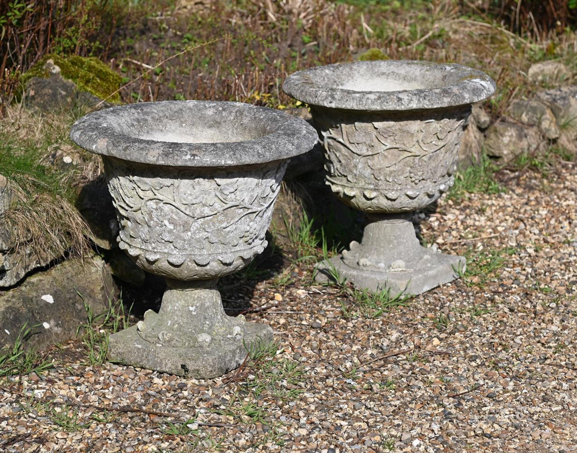 A PAIR OF STONE COMPOSITION URNS, 20TH CENTURY