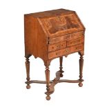 A GEORGE I WALNUT BUREAU, CIRCA 1720