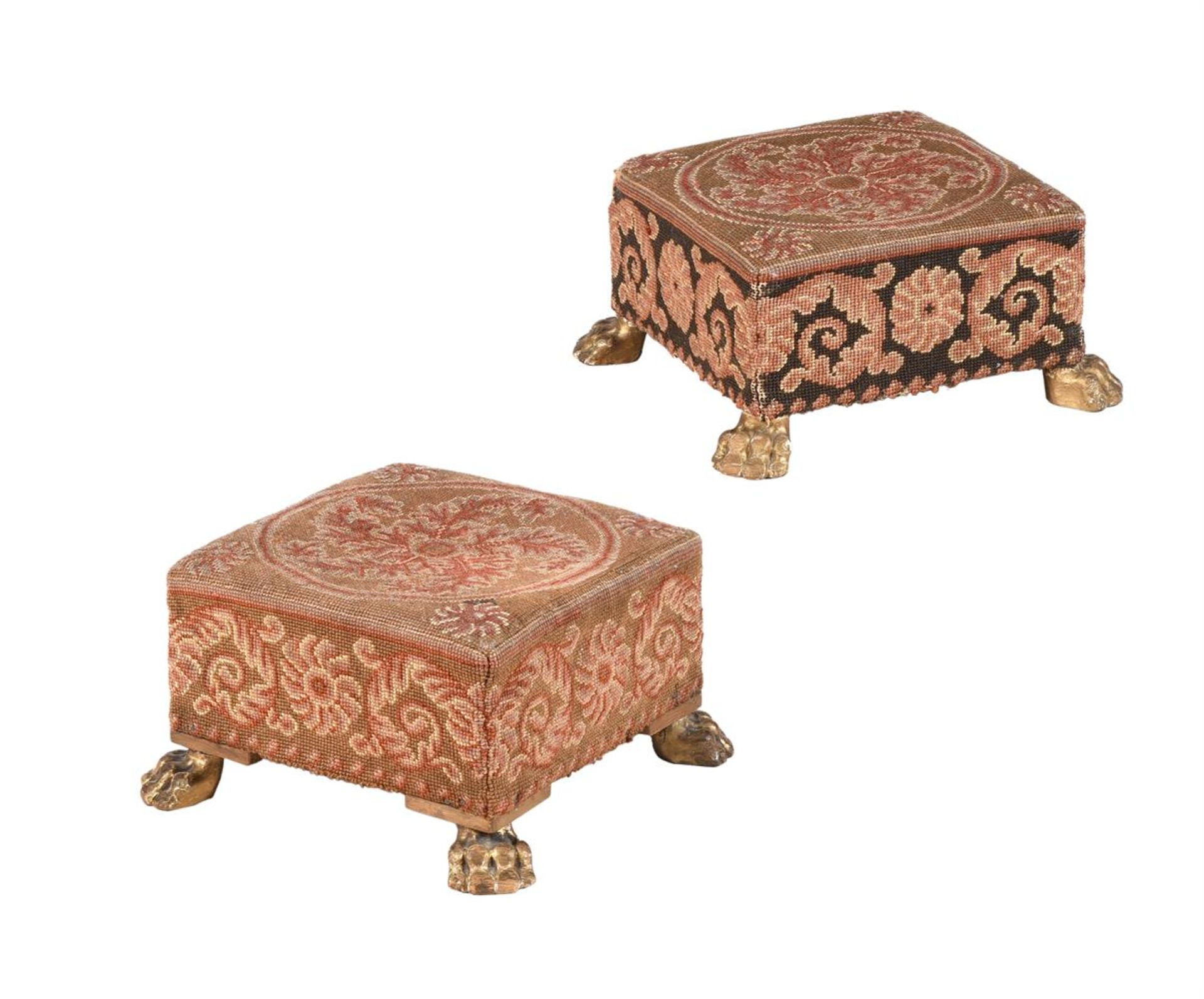 TWO SIMILAR NEEDLEWORK COVERED FOOT STOOLS INCORPORATING 19TH CENTURY AND LATER ELEMENTS