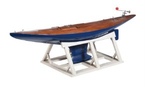 A PART BUILT MODEL OF A RACING YACHT