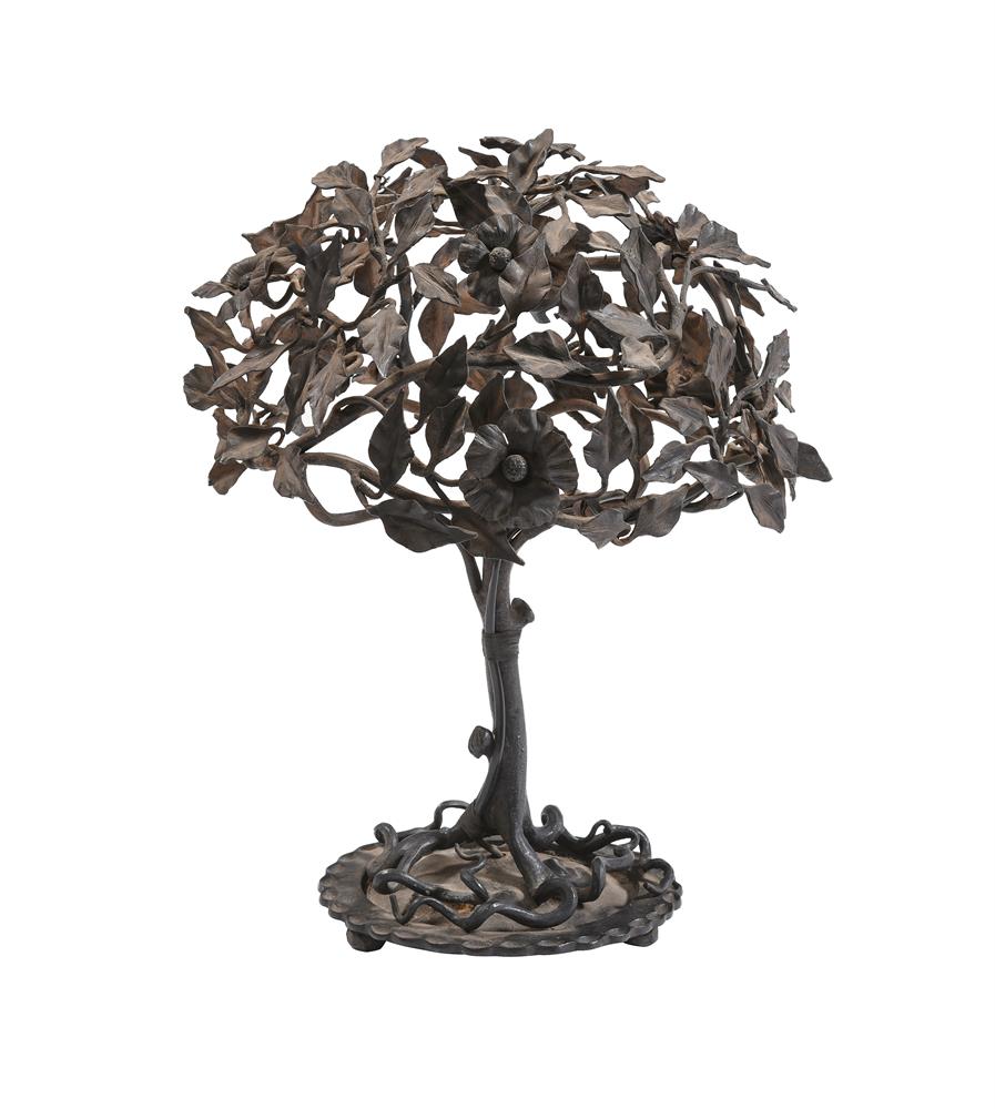 A WROUGHT IRON LAMP BASE IN THE MANNER OF GIACOMMETI