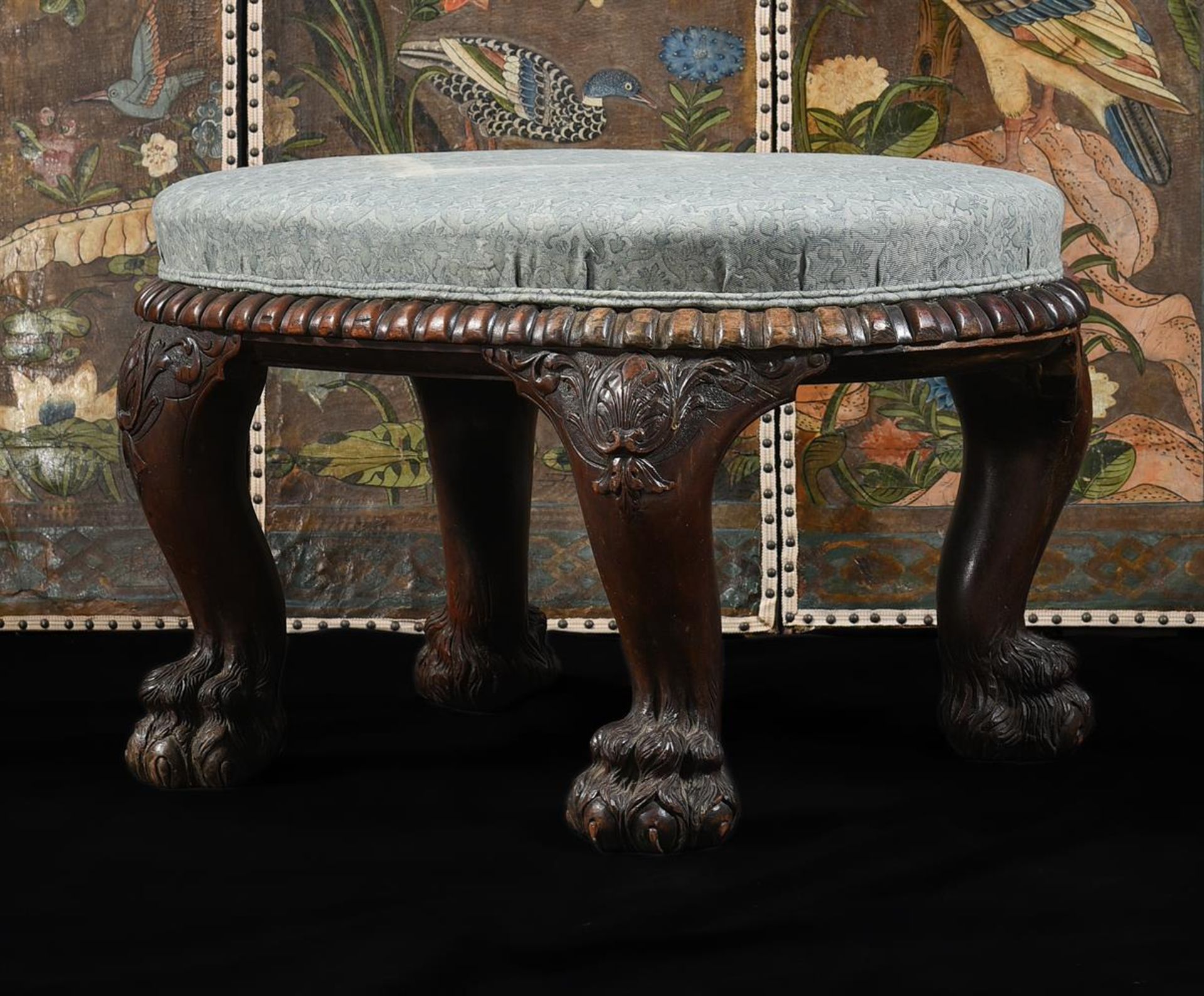 A LARGE ANGLO-INDIAN CARVED HARDWOOD AND UPHOLSTERED STOOL, MID 19TH CENTURY