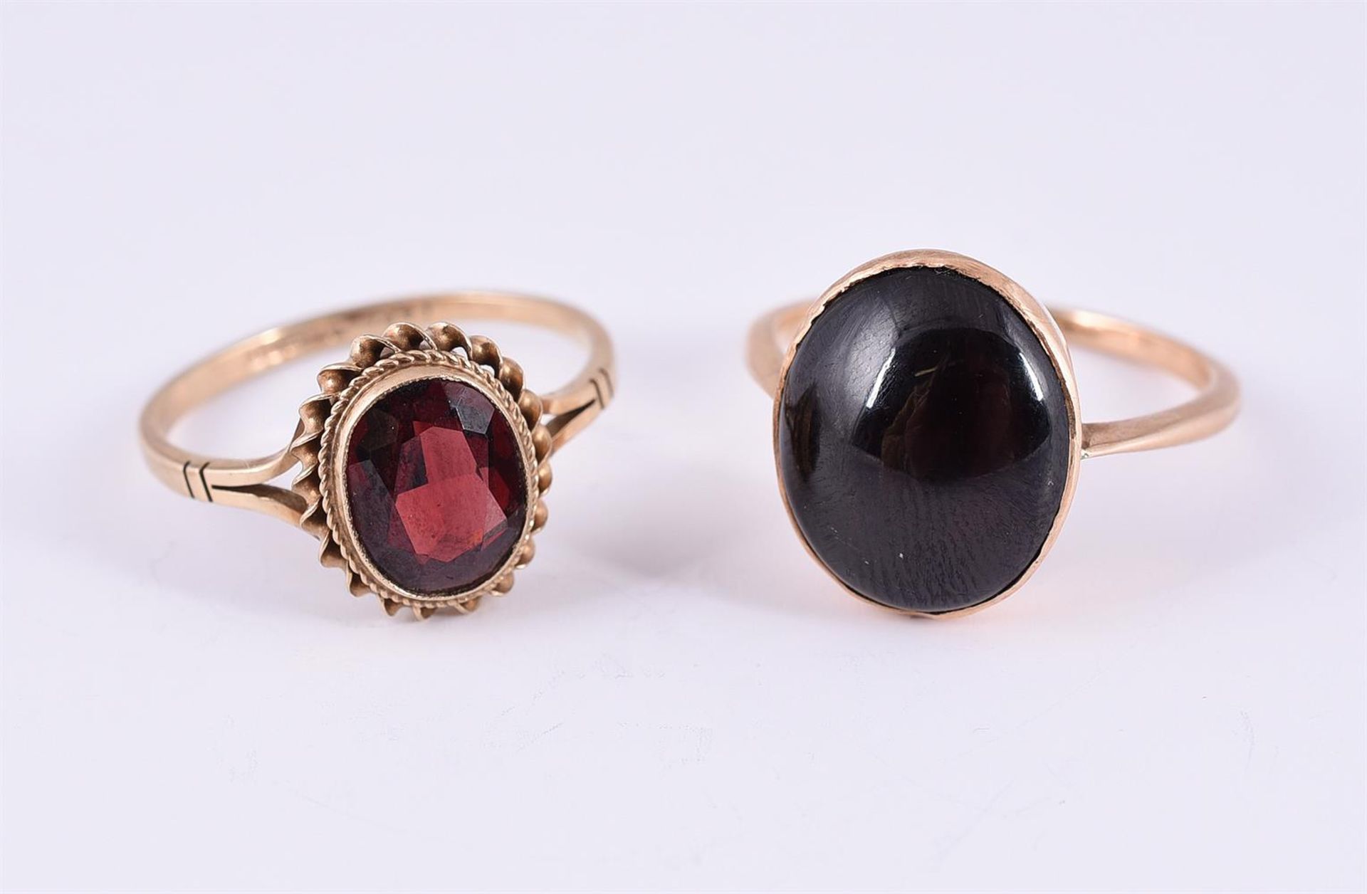 TWO GARNET RINGS