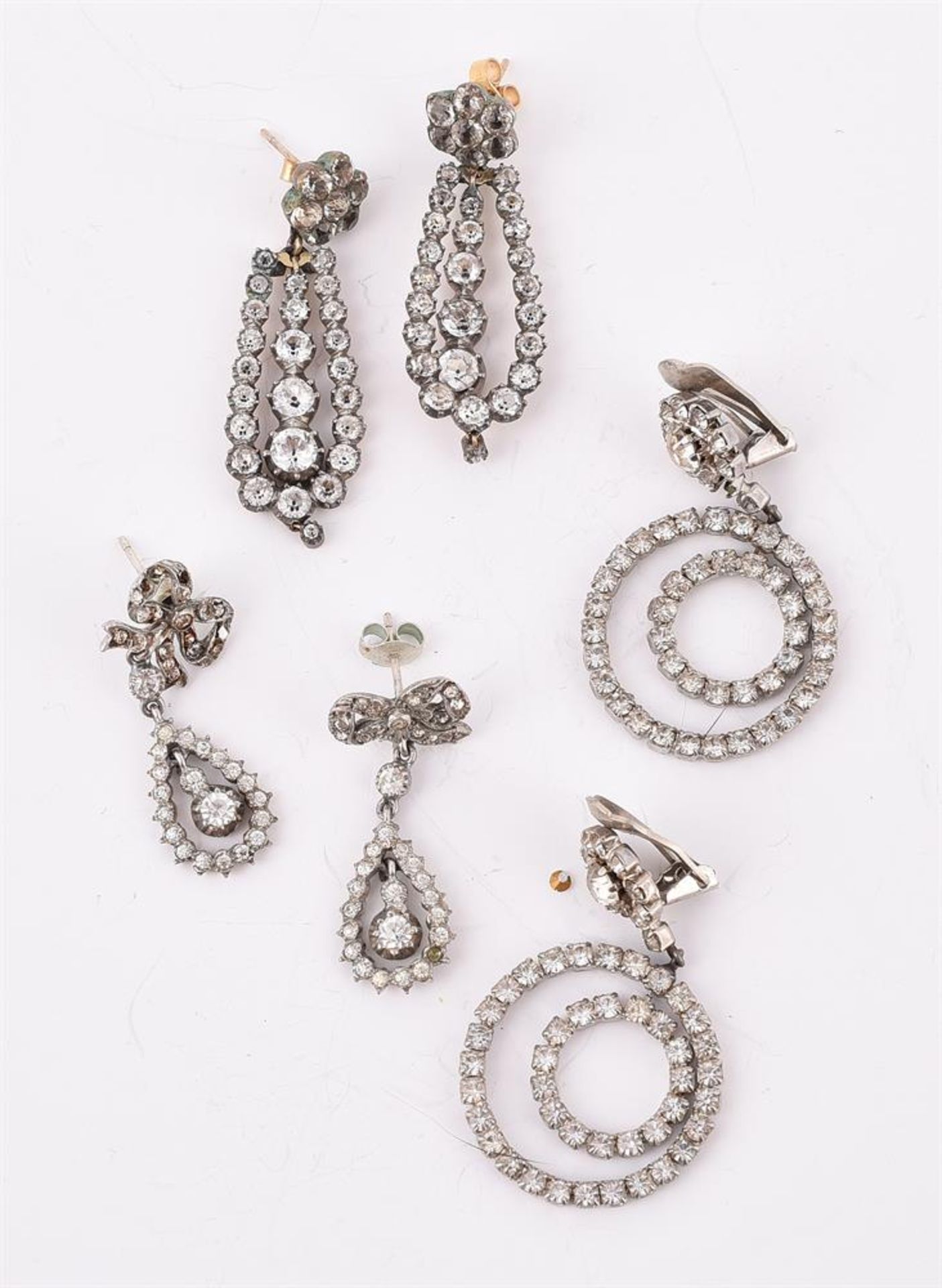 A PAIR OF ANTIQUE AND LATER WHITE PASTE EARRINGS