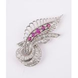 A FRENCH RUBY AND DIAMOND SCROLLING FOLIATE BROOCH MID 20TH CENTURY