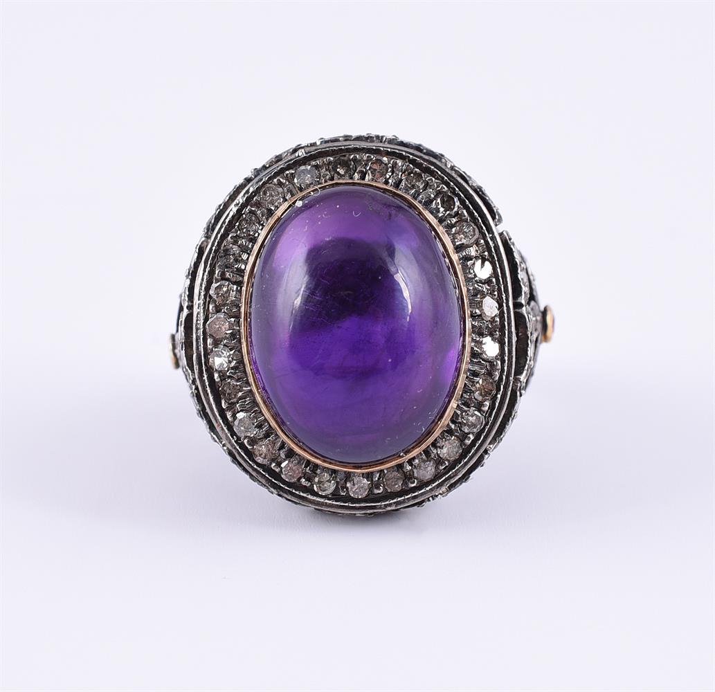 AN AMETHYST AND DIAMOND DRESS RING