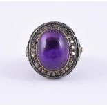 AN AMETHYST AND DIAMOND DRESS RING