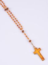 J. B. SORENSEN, A HEATED AMBER ROSARY