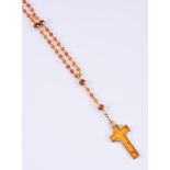 J. B. SORENSEN, A HEATED AMBER ROSARY