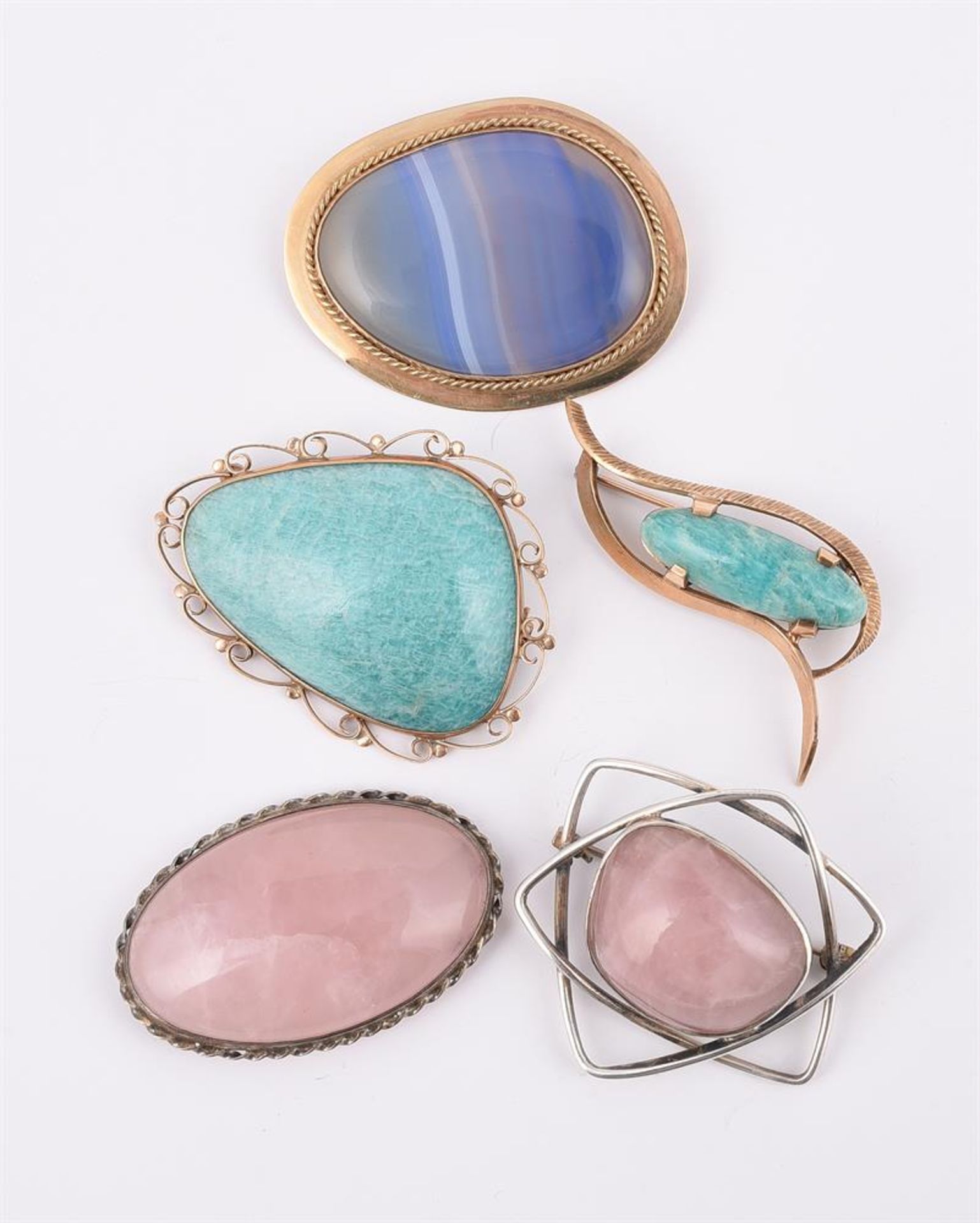 FIVE HARDSTONE BROOCHES