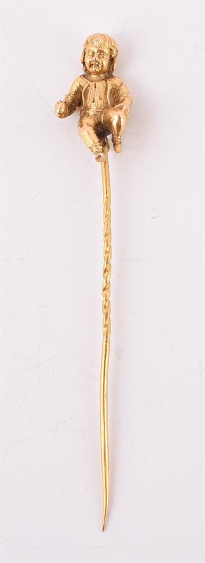 A MID VICTORIAN GOLD STICKPIN OF A BOY