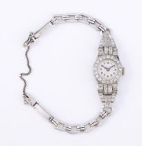 UNSIGNED, A LADY'S PRECIOUS WHITE METAL AND DIAMOND COCKTAIL WATCH