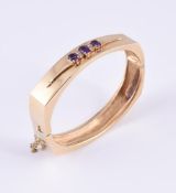 AN AMETHYST AND DIAMOND BANGLE