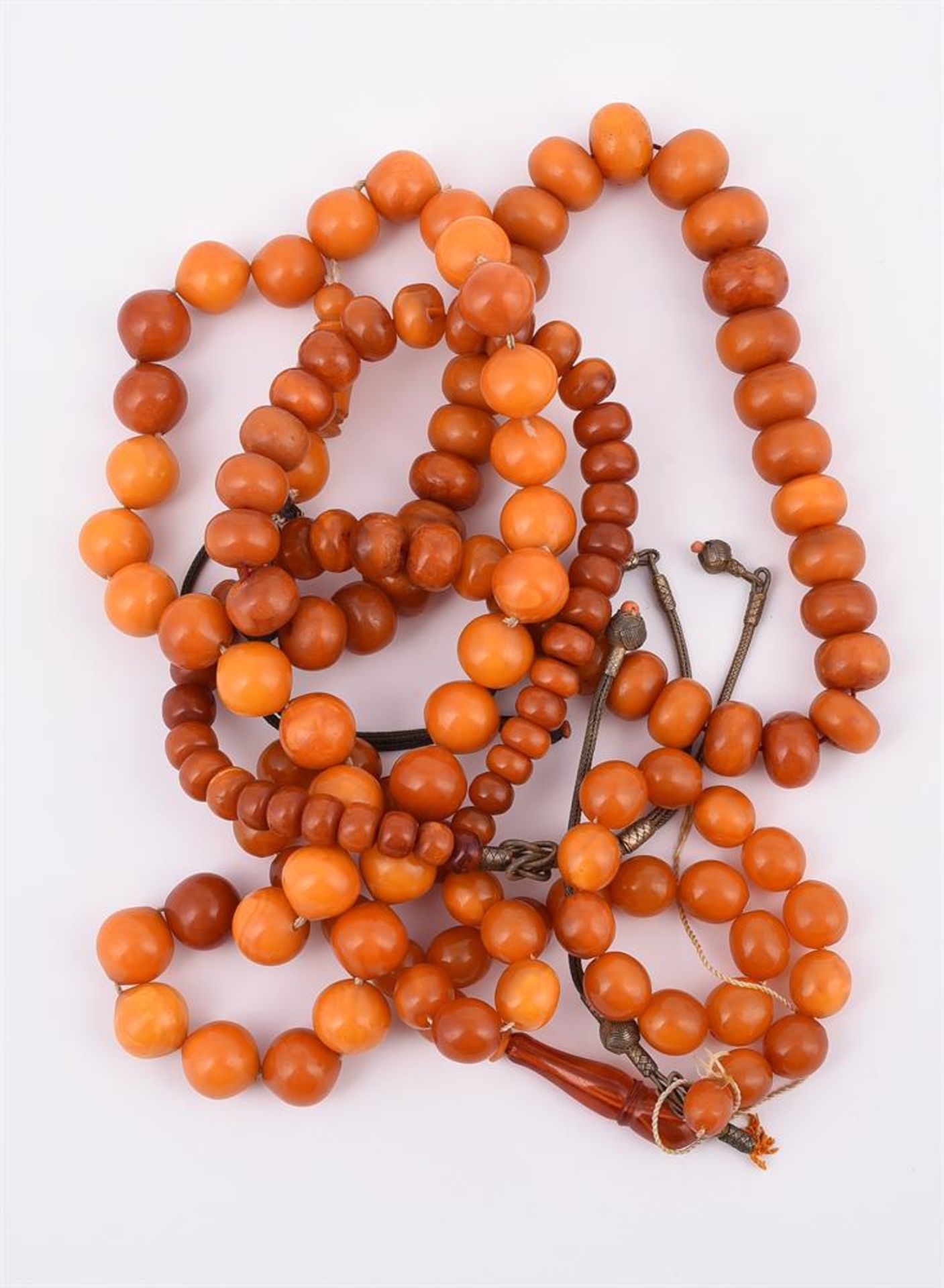 Y THREE AMBER PRAYER BEADS