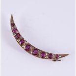 A LATE VICTORIAN DIAMOND AND RUBY CRESCENT BROOCH, CIRCA 1900