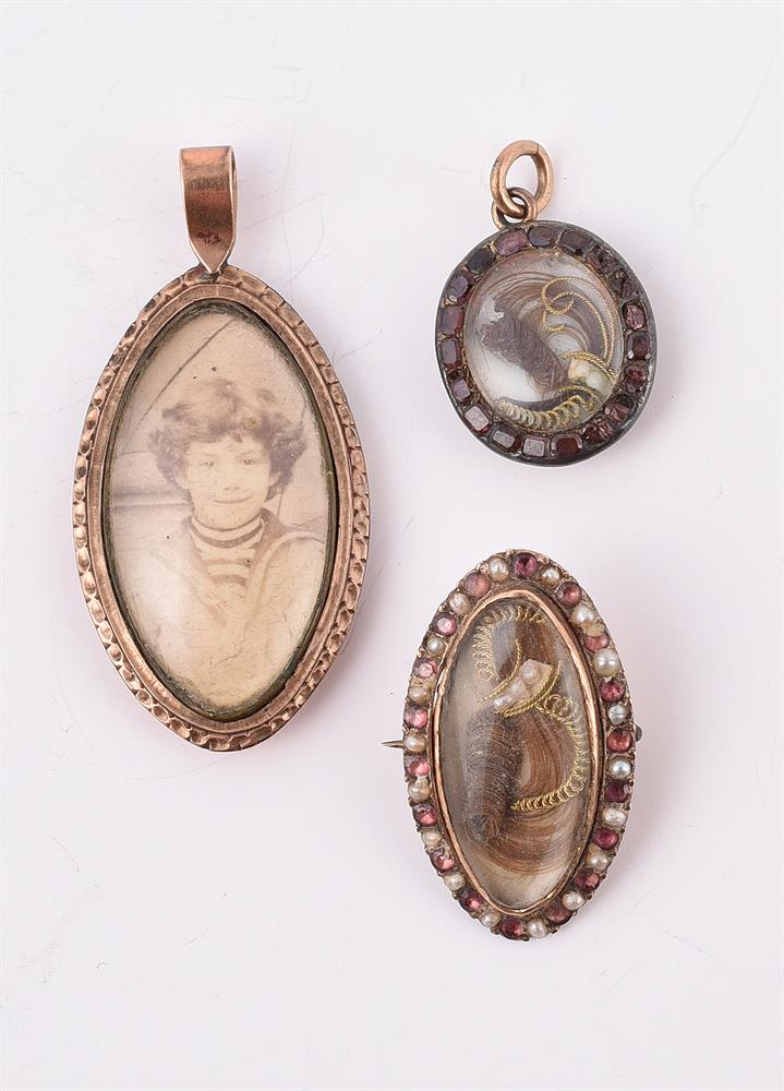 TWO ANTIQUE LOCKET PENDANTS AND A BROOCH