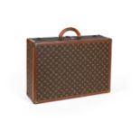 LOUIS VUITTON A MONOGRAMMED COATED CANVAS HARD SUITCASE