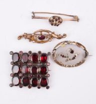 A SMALL COLLECTION OF ANTIQUE GARNET SET BROOCHES