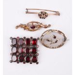 A SMALL COLLECTION OF ANTIQUE GARNET SET BROOCHES