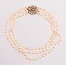 A THREE ROW CULTURED PEARL NECKLACE WITH A DIAMOND AND HALF CULTURED PEARL CLASP, LONDON 1988
