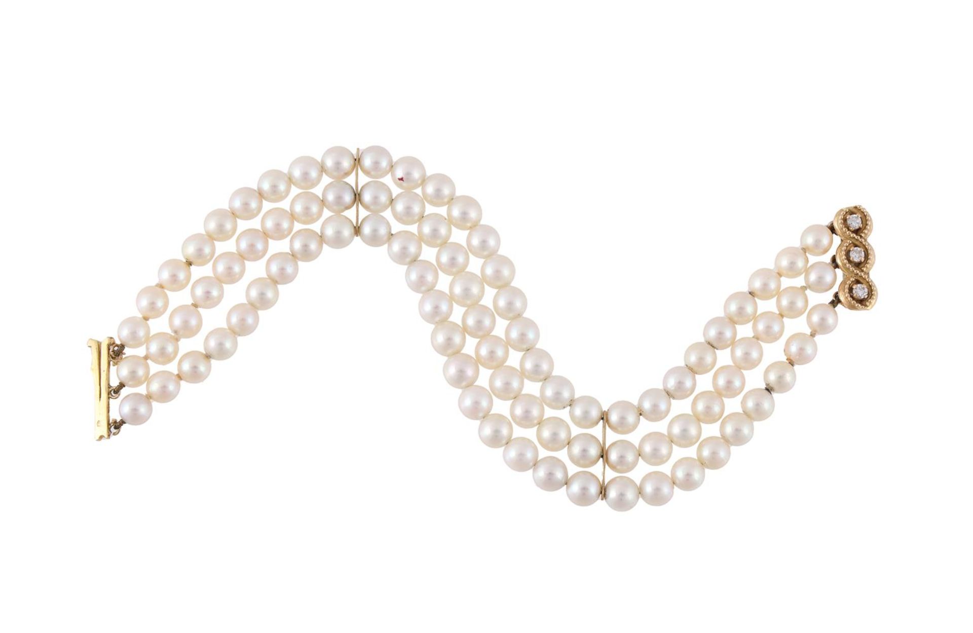 A FRENCH THREE STRAND CULTURED PEARL BRACELET WITH A DIAMOND CLASP