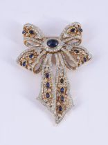 A SAPPHIRE AND DIAMOND PIERCED BOW BROOCH