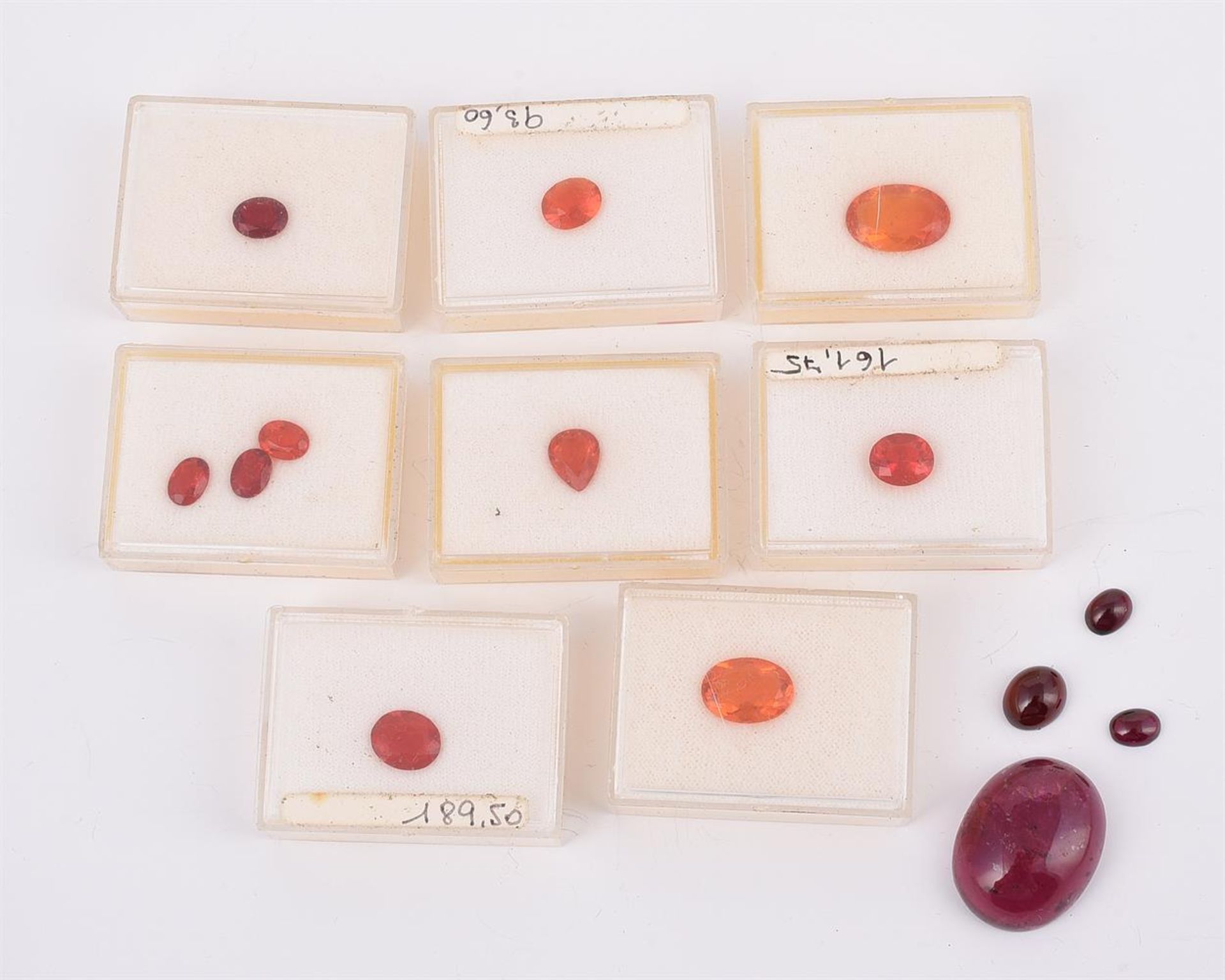 A COLLECTION OF UNMOUNTED FIRE OPALS AND A CABOCHON PINK TOURMALINE