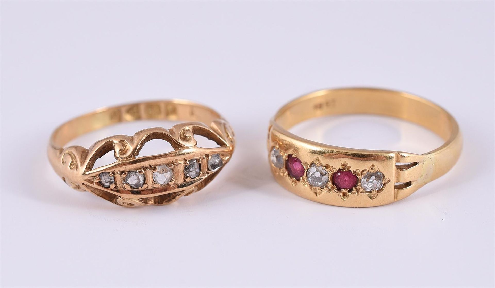 AN EARLY 20TH CENTURY DIAMOND FIVE STONE RING AND A DIAMOND AND RED STONE RING