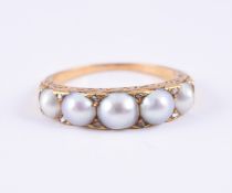 A HALF PEARL AND DIAMOND RING
