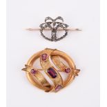 A MID VICTORIAN GARNET RIBBON BROOCH