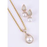 A CULTURED PEARL PENDANT NECKLACE AND EARRINGS