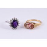 AN AMETHYST AND DIAMOND CLUSTER RING AND A PINK TOURMALINE DRESS RING